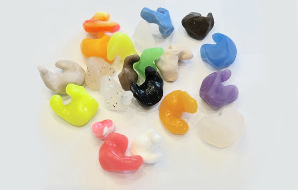 Custom ear plugs of various colours